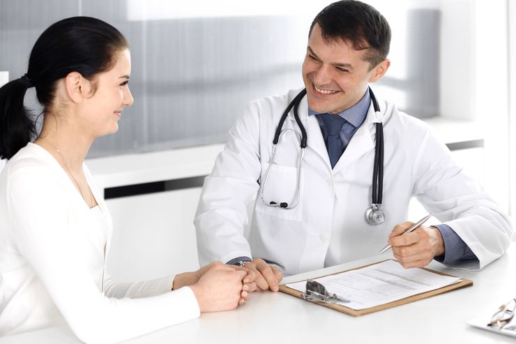 Doctor discussing medication options with patient during consultation