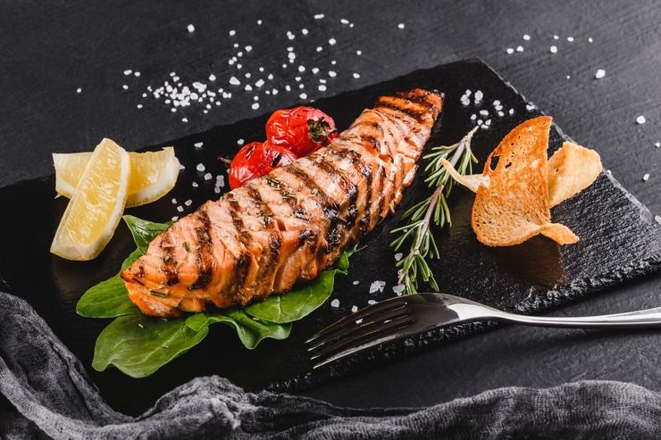Grilled salmon with vegetables, a vitamin D and omega-3 rich meal for bone health